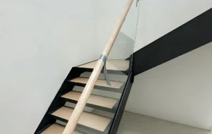 Custom steel stringer stairs with solid oak treads and glass balustrade, Melbourne project