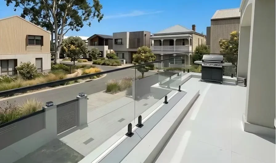 Frameless Glass Railing System installed on a modern rooftop deck overlooking urban view