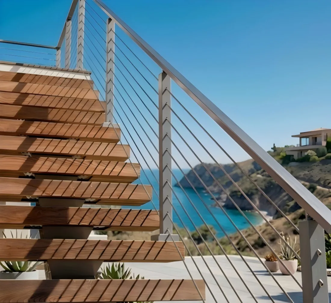 Stainless steel cable railing system installed on coastal exterior floating stairs